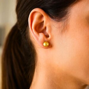 Model Wearing 14k Yellow Gold 7mm Ball Stud Earrings with Faceted Texture