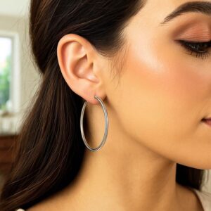 14K White Gold 3mm x 50mm hoop earrings in ears