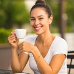 14k Yellow Gold Pebble Bracelet with Textured and Polished Pebble Stations on model