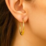 14k Yellow Gold Puffed Graduated Open Oval Hoop Earrings On Model (2)