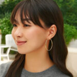 55mm Hoop Earrings 2mm Thickness 14k Yellow Gold on model 55mm Hoop Earrings 2mm Thickness 14k Yellow Gold on model