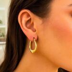 Large Heart Hoop Earrings in 14K Yellow Gold on Model