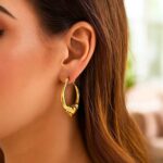 Model Wearing Large Heart Hoop Earrings in 14K Yellow Gold