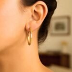 Model Wearing Twist Texture Hoop Earrings 14k Two Tone Gold 3mm x 30mm