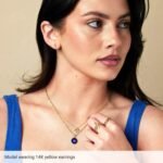 Model Wearing 14K Gold Dagger Stud Earrings