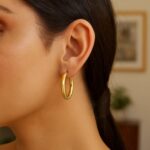 Model Wearing Large Half Twisted Hoop Earrings 14K Yellow Gold Model Wearing Large Half Twisted Hoop Earrings 14K Yellow Gold