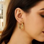 30 mm Large Twisted Hoop Earrings 14K Yellow Gold on Model 30 mm Large Twisted Hoop Earrings 14K Yellow Gold on Model