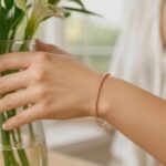 Diamond Cut Stack Bangle Bracelet 1.8 mm 14K Rose Gold on Model Diamond Cut Stack Bangle Bracelet 1.8 mm 14K Rose Gold on Model