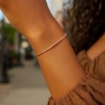 Model Wearing Real Diamond Cut Stack Bangle Bracelet 1.8 mm 14K Rose Gold Model Wearing Real Diamond Cut Stack Bangle Bracelet 1.8 mm 14K Rose Gold