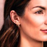 Model Wearing 14K Gold Spiked Hoop Earrings Model Wearing 14K Gold Spiked Hoop Earrings