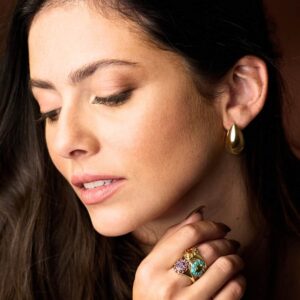 Model Wearing 14K Yellow Gold Medium Tapered Chunky Hoop Earrings 25mm