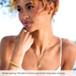 Model Wearing Pear Shaped Stud Earrings 14K Gold